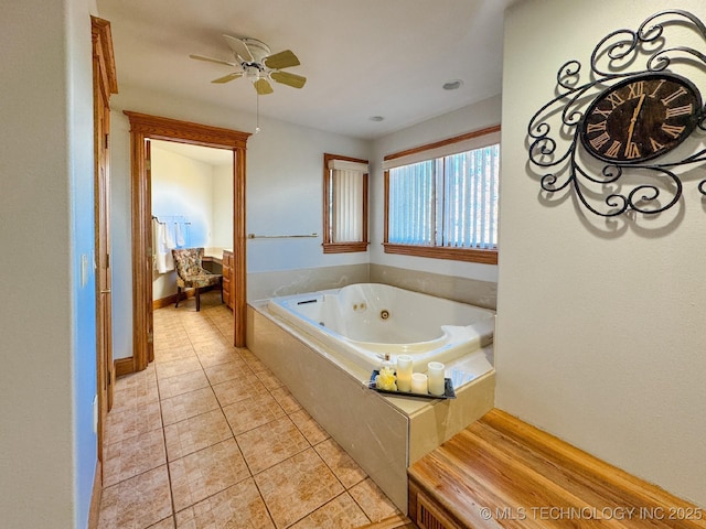 bathroom featuring tile patterned flooring, a relaxing tiled tub, and ceiling fan