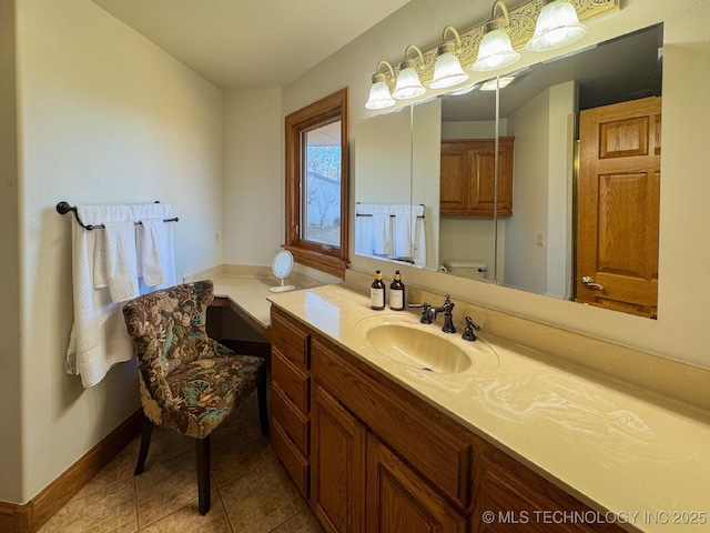 bathroom with vanity, tile patterned floors, and toilet