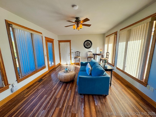 living room with ceiling fan and hardwood / wood-style floors