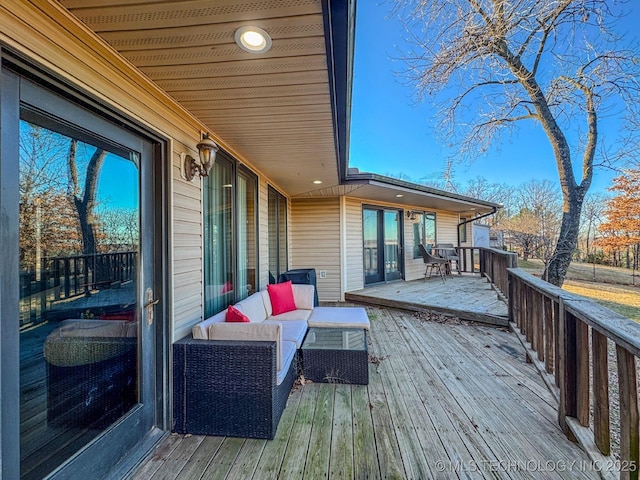 wooden terrace with outdoor lounge area