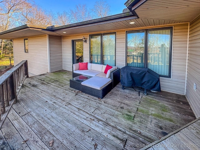 deck featuring grilling area and outdoor lounge area