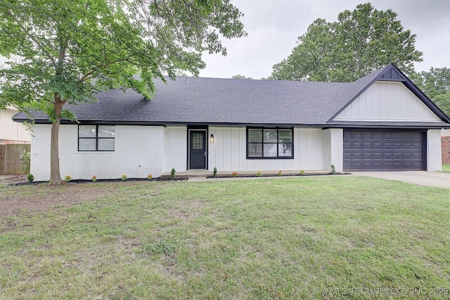 single story home with a garage and a front yard