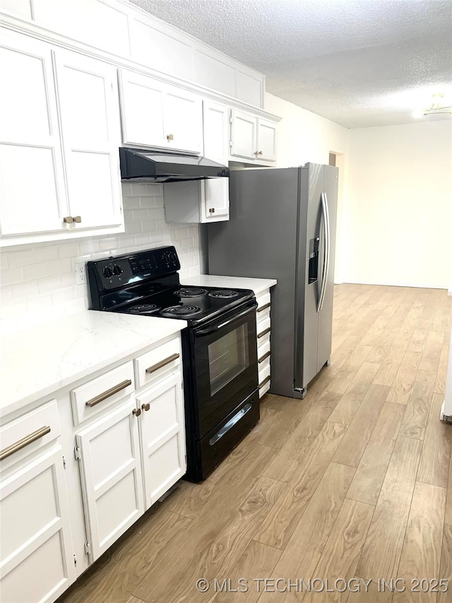 kitchen with white cabinets, black electric range oven, a textured ceiling, and light hardwood / wood-style flooring