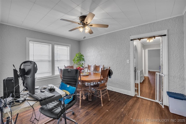 office featuring crown molding, dark hardwood / wood-style flooring, and ceiling fan