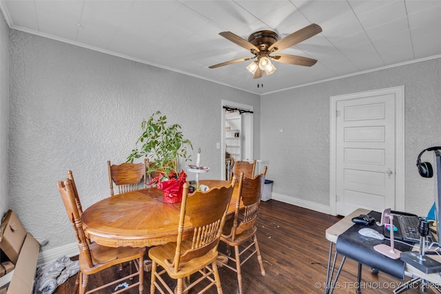 dining room with ceiling fan, dark hardwood / wood-style flooring, and crown molding