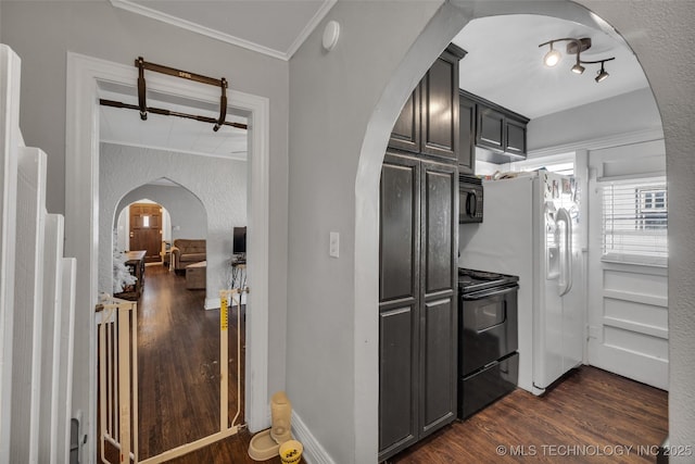 kitchen featuring black appliances, dark hardwood / wood-style floors, and ornamental molding