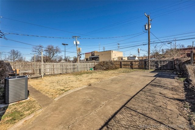 view of yard featuring a patio area and central AC unit