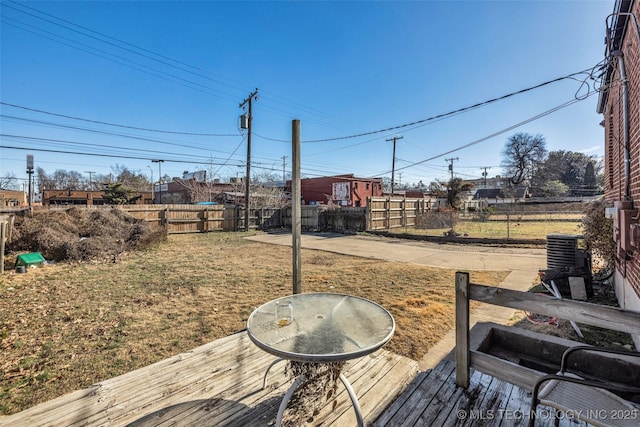 wooden deck featuring a yard