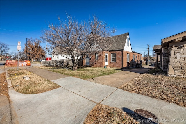 view of property exterior with a yard