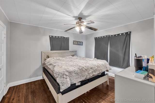 bedroom with ceiling fan and hardwood / wood-style floors