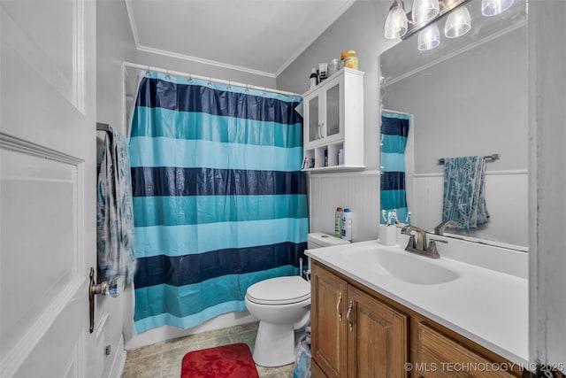 bathroom featuring vanity, tile patterned floors, crown molding, toilet, and walk in shower