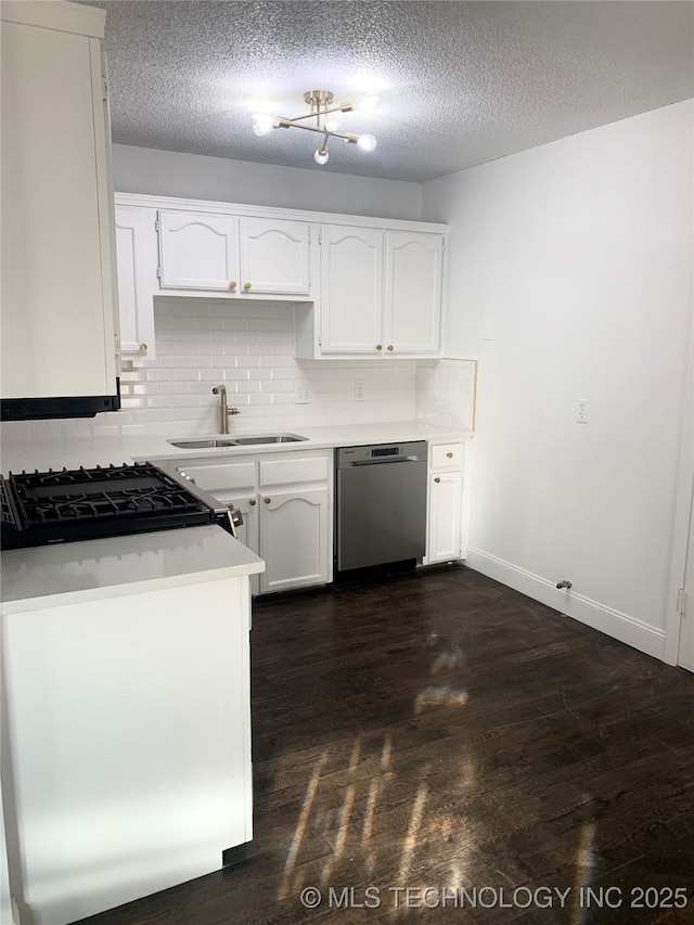 kitchen with dishwasher, sink, a textured ceiling, decorative backsplash, and white cabinets