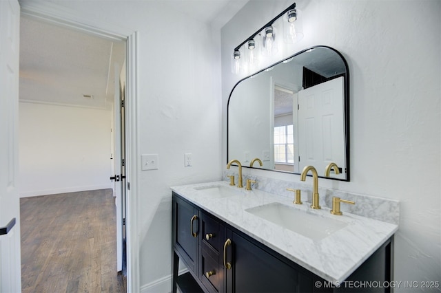 bathroom with hardwood / wood-style flooring and vanity