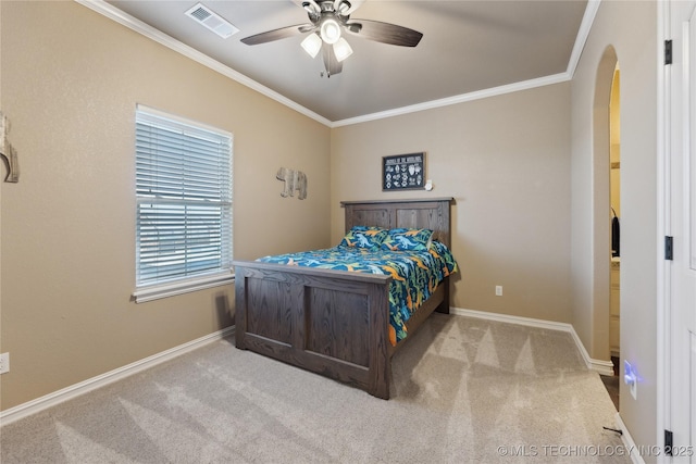 bedroom with light colored carpet, ceiling fan, and crown molding