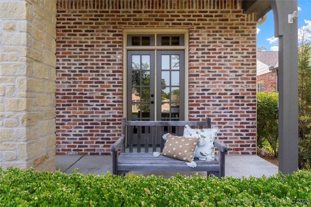 view of exterior entry featuring french doors