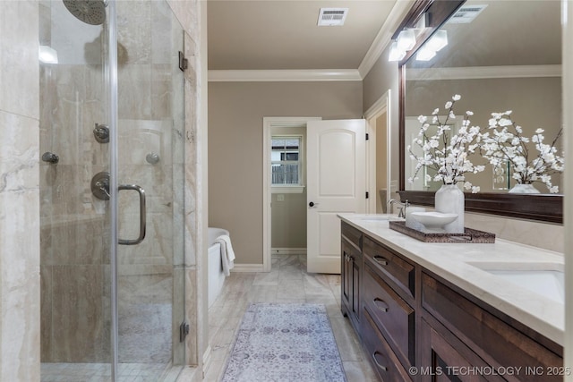 bathroom with vanity, an enclosed shower, and ornamental molding