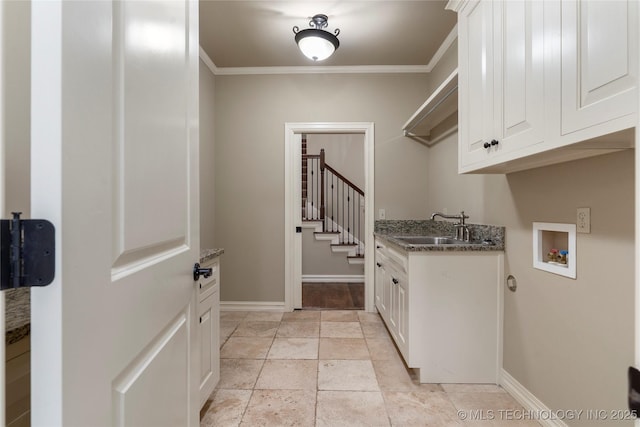 laundry room with cabinets, sink, crown molding, and hookup for a washing machine