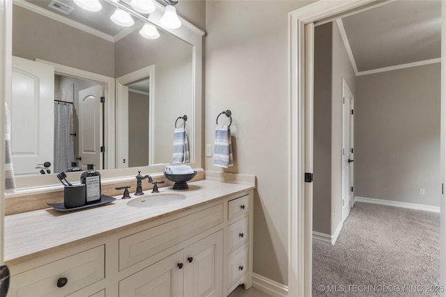 bathroom featuring crown molding and vanity