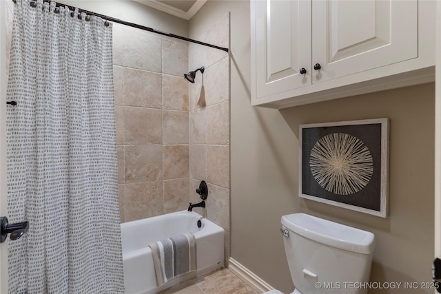 bathroom featuring crown molding, shower / tub combo with curtain, and toilet