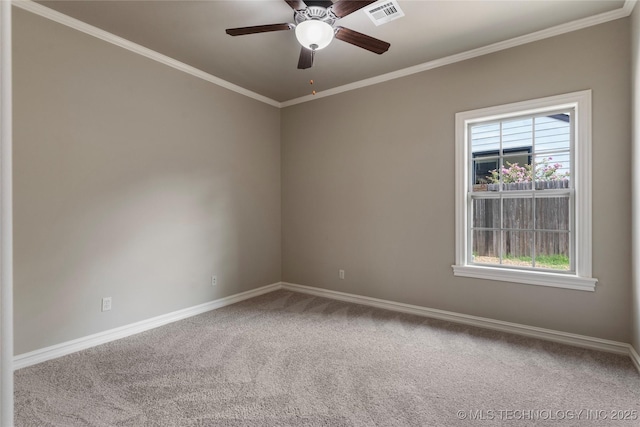 carpeted empty room with ceiling fan and ornamental molding