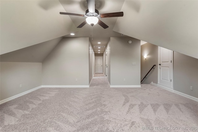 bonus room with ceiling fan, light colored carpet, and lofted ceiling