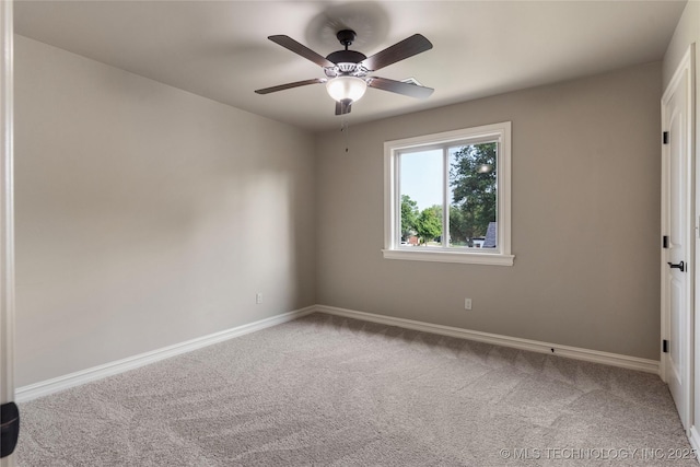 spare room featuring ceiling fan and carpet floors