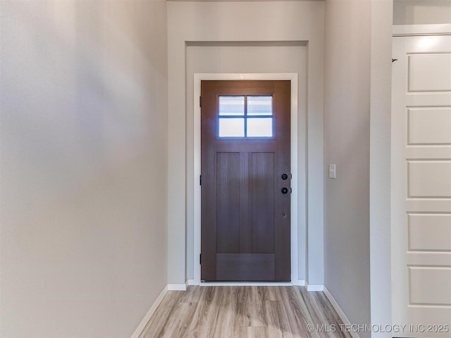 doorway with light hardwood / wood-style flooring