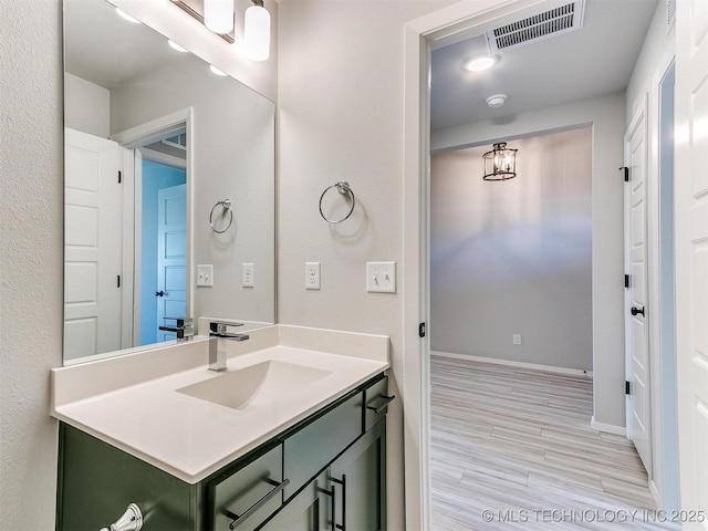 bathroom featuring vanity and wood-type flooring