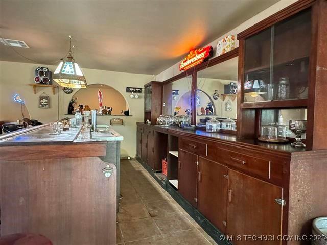 kitchen with a kitchen island with sink