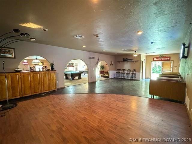 exercise area featuring hardwood / wood-style floors, ceiling fan, a textured ceiling, and pool table