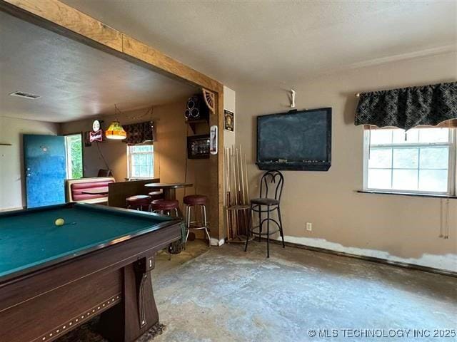 recreation room featuring bar area and billiards