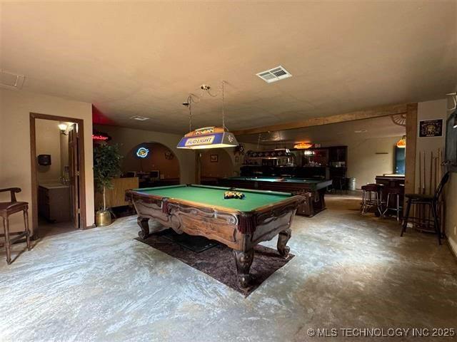 rec room with concrete flooring and pool table