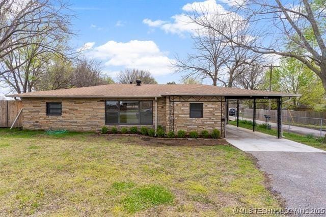 single story home with a carport and a front lawn