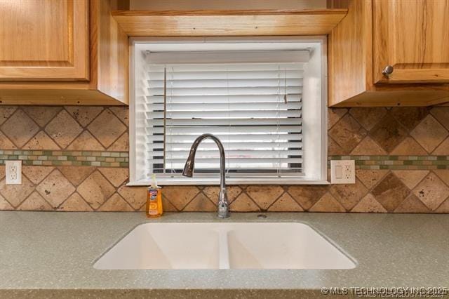 kitchen with decorative backsplash and sink