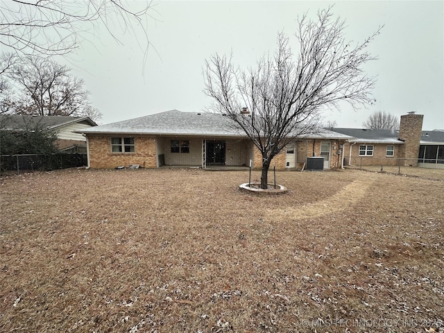 back of property with central air condition unit