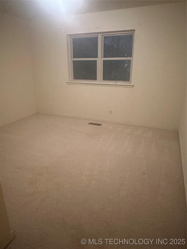 empty room with carpet flooring