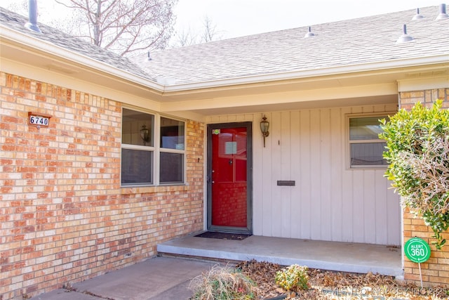 6740 E 51st Pl, Tulsa, OK 74145 - entrance to property featuring a shingled roof and brick siding