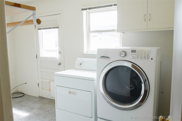 6740 E 51st Pl, Tulsa, OK 74145 - clothes washing area with separate washer and dryer, cabinet space, plenty of natural light, and light floors