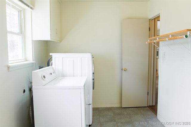 6740 E 51st Pl, Tulsa, OK 74145 - laundry area featuring washer / dryer, healthy amount of natural light, and baseboards