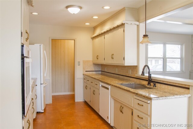 6740 E 51st Pl, Tulsa, OK 74145 - kitchen with a sink, white appliances, decorative backsplash, light tile patterned floors, and recessed lighting