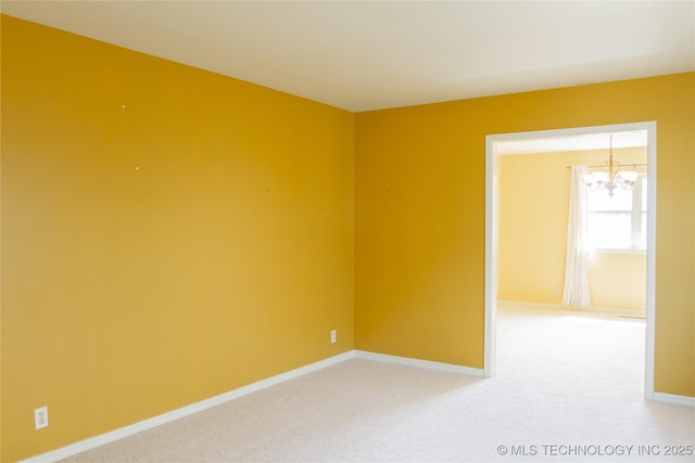 6740 E 51st Pl, Tulsa, OK 74145 - unfurnished room featuring a chandelier, baseboards, and light colored carpet