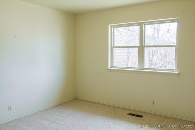 6740 E 51st Pl, Tulsa, OK 74145 - spare room with healthy amount of natural light, carpet, and baseboards