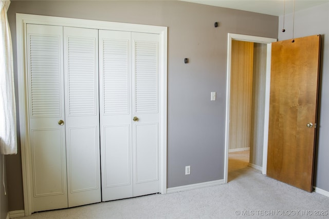 6740 E 51st Pl, Tulsa, OK 74145 - unfurnished bedroom featuring a closet, carpet flooring, and baseboards