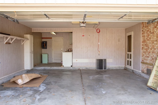 6740 E 51st Pl, Tulsa, OK 74145 - garage with electric panel and a garage door opener