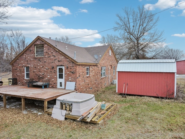 back of house with a deck