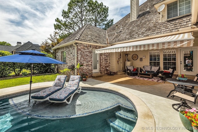 view of pool featuring an outdoor living space and a patio