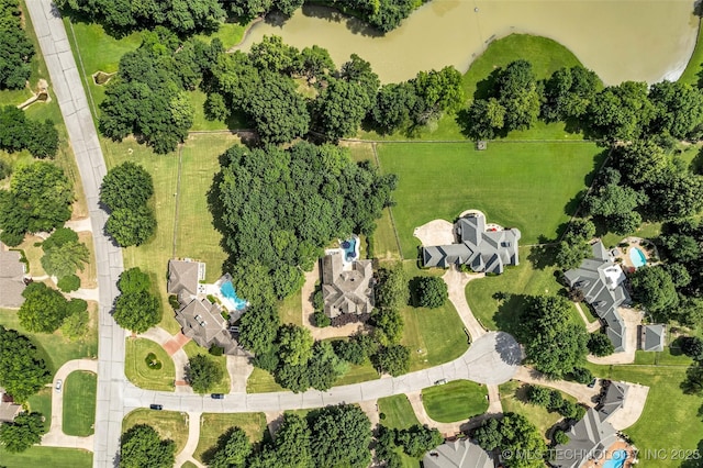 birds eye view of property featuring a water view