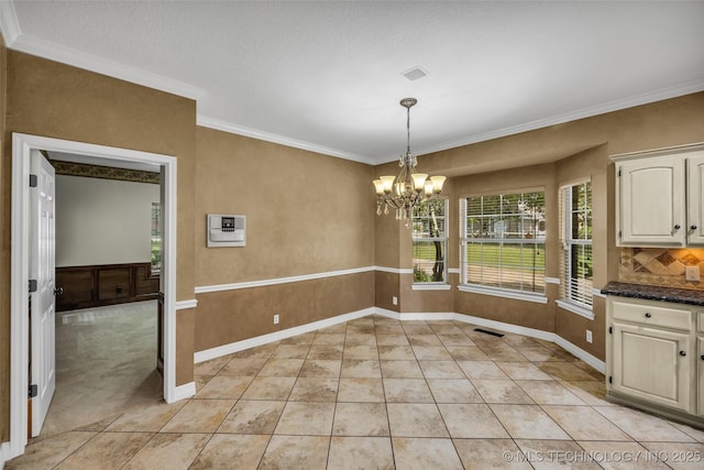 unfurnished dining area featuring light tile patterned floors, a notable chandelier, visible vents, baseboards, and ornamental molding