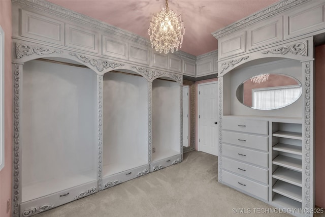 walk in closet featuring light carpet and an inviting chandelier