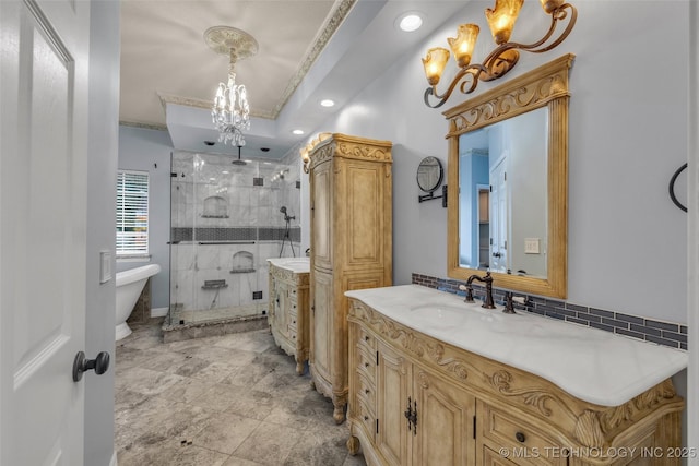 bathroom featuring vanity, crown molding, plus walk in shower, and a chandelier